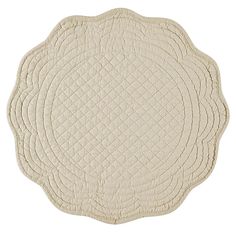 a white rug with an oval design on it