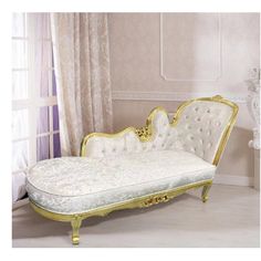 an ornate gold and white chaise lounger in a living room with curtains on the windowsill