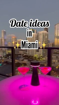 two martini glasses sitting on top of a table with the words date ideas in miami