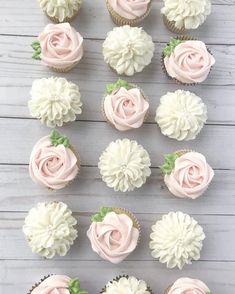 cupcakes with pink frosting and white flowers