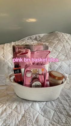 pink bridal basket sitting on top of a white bed with the words pink bridal