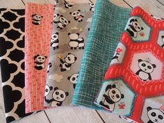 four different patterns of pandas on fabric