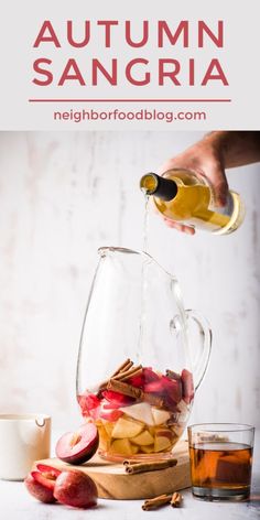 someone pouring apple cider into a glass pitcher