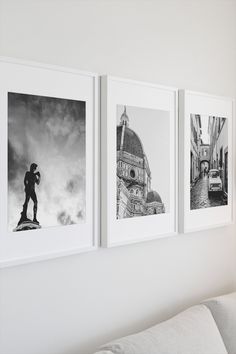 three black and white photographs hang on the wall above a couch in a living room