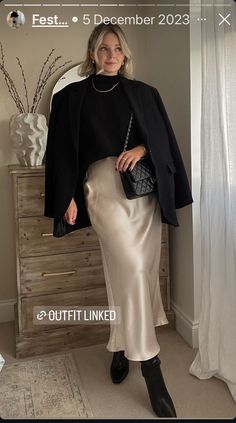 Silk Skirt Oversized Sweater, Christmas Party Outfits Satin Skirt, Satin Skirt Knee High Boots, Satin Skirt Thanksgiving Outfit, Date Night Outfit Ideas Fall, Silk Skirt Outfits Winter, Silk Skirt And Boots, Beige Slip Skirt Outfit, Beige Skirt Winter Outfit