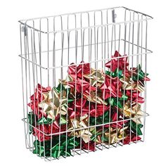 a metal basket filled with lots of wrapped christmas presents on top of a white background