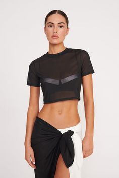 The Fernanda Top is a cropped t-shirt style swim coverup in our stretchy power mesh fabric. This style features a crewneck, short sleeves, and can be paired with the Marza Pant or Kiana Sarong for a full look. Black Athleisure T-shirt For Summer, Black Mesh Cropped Top, Black Cropped Mesh Top, Black Cropped T-shirt For Summer, Summer Athleisure Mesh Crop Top, Summer Mesh Athleisure Crop Top, Sporty Cropped T-shirt With Short Sleeves For Summer, Summer Athleisure Tops For Night Out, Sporty Black Crop Top For Summer