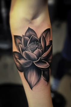 Black and white lotus flower tattoo on forearm. Lotus Flower Tattoo On Black Women, Men’s Lotus Flower Tattoo, Realism Lotus Tattoo, Simple Tattoo Cover Up Ideas, Lotus Flower Tattoo Black And White, Cute Coverup Tattoos, Dark Lotus Flower Tattoo, Lotus Foot Tattoo, Cover Up Ideas Tattoo For Women