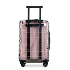 a pink and black suitcase on wheels with handles, in front of a white background