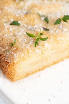 a close up of a piece of cake on a plate with sprinkles