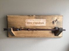 an old fashioned hammer is mounted on the wall