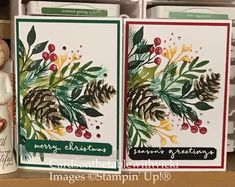 two christmas cards with pine cones and evergreens on them, one has a teddy bear