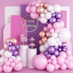 a pink and purple birthday party with balloons