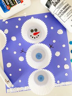 paper plate snowman craft for kids to make with construction paper and glue on the table