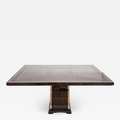 an art deco dining table with glass top