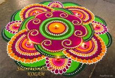 an artistically designed rangolite design on the ground for diwaling and decorating