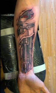 a man's arm with a tattoo on it that has a bike in the middle