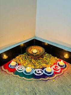 a decorated plate with candles on the floor