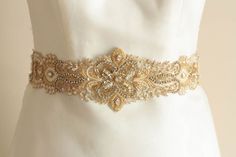 Gold Bridal Belt, Wedding dress belt with clasp, All around gold bridal belts and sashes, Style -  Ivory Gold 28 to 29 inchesWedding belts & Sashes, Wedding belts, Bridal dress belts* Total length of the beaded section on this gold bridal belt is about 28 to 29 inches, and width is 3.4 inches in the center and tapers to 2 inches approximately on either sides* Finished with Ivory ribbon.* Depending on the waist size this would be an all around belt and can also be complete with a hook/eye. If Hollywood Glamor, Sparkly Belts, Bridal Sash Belt, Simple Wedding Dress, Wedding Dress Belt, Wedding Sash Belt, Swarovski Crystal Bracelet, Wedding Sash, Bridal Sash