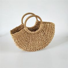 This Half-round Rattan Tote is the perfect bag for a boho babe on the go! The open top makes it easy to grab whatever you need, and the woven rattan grass straw material is sturdy and stylish. Plus, the natural color will complement any outfit. Product Details Material: Rattan﻿Shipping: ﻿Imported (est. 18 days) Rattan Handbags, Vacation Accessories, Sustainable Bag, Rattan Bag, Bag Stand, Round Bag, Tassel Bag, Types Of Bag, Woven Bag