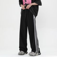 For those who like to take risks, these vintage Striped Wide Leg Drape Sweatpants are the perfect fit! With their bold striped design and drape feature, they offer a unique style that will make you stand out in any crowd. Take the plunge and live boldly! Features: -100% Cotton -Mid-rise Waist -Drawstring Waistband -Regular Fit -Street Style Streetwear Wide Leg Bottoms With Three Stripes, Wide Leg Pants With Three Stripes For Streetwear, Trendy Striped Pants For Streetwear, Striped Cotton Pants For Streetwear, Casual Pants With Contrast Stripes For Streetwear, Streetwear Trousers With Side Stripes, Casual Streetwear Pants With Contrast Stripes, Casual Striped Streetwear Pants, Streetwear Bottoms With Contrast Stripes