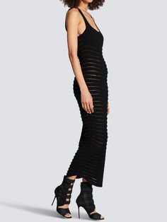 Sleeveless black midi stretch ribbed knit dress. It features cut-out details and zip closure on the back. Semi-sheer design. The model is 177cm tall and wears size S. Size nationality: FR Product number: 3789483 Product code: YF0RJ085KC800PA Composition: 83% viscose, 17% polyester Sleeveless Ribbed Maxi Dress For Evening, Black Sleeveless Ribbed Maxi Dress, Sleeveless Black Ribbed Maxi Dress, Sleeveless Ribbed Bodycon Evening Dress, Sleeveless Ribbed Bodycon Dress For Evening, Midi Knit Dress, Balmain Blazer, Ribbed Knit Dress, Saint Laurent Shoes