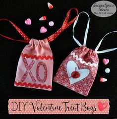 two valentine treat bags with hearts on them