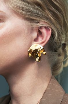 These handcrafted earrings featuring an artfully folded design are the perfect way to elevate your look. 1" drop; 1 1/2" width 14k-gold plate Made in the USA Suede Jewelry, Chunky Sweaters, Gold Vermeil Jewelry, Choker Pendant, Oil Slick, Gold Pearl Earrings, Solid Gold Jewelry, Delphinium, Crystal Drop Earrings