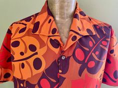 Vintage short sleeve Hawaiian shirt - brown and orange leaf print.  Button closure. Size Extra Large Measurements: Chest: 126 cm/ 50 inches Shoulder: 48 cm / 19 inches Length: 71 cm / 28 inches Sleeve Length: 27 cm / 10.5 inches This item is one of a kind. BUYING VINTAGE: While all care is taken to state any obvious faults, please note that when you buy a vintage or preloved item, they may show small signs of ageing, wear and/or repair. Visit my new website   https://phoenixmenswear.com.au/ Lots of fun stuff for guys and girls...!! Please note that if you are ordering from anywhere outside of Australia please add your phone number as it is now required for delivery.  Thanks much. Brown Short Sleeve Hawaiian Shirt, Brown Short Sleeve Camp Shirt For Beach, Brown Short Sleeve Hawaiian Top, Brown Hawaiian Short Sleeve Tops, Orange Short Sleeve Hawaiian Shirt, Vintage Brown Hawaiian Shirt With Short Sleeves, Brown Vintage Hawaiian Shirt With Short Sleeves, Brown Printed Camp Shirt With Short Sleeves, Hawaiian Print Shirts