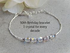 "This 50th birthday bracelet is a beautiful on it's own or great for layering and makes the perfect 50th Birthday gift! This crystal bracelet would also make a great gift for anyone that loves sparkle.   Made with 5 faceted crystals one for every decade, sterling silver twisted tube beads and sterling silver round beads.  The crystals have an ab coating for that added sparkle! This would also make a perfect April Birthday gift as crystal is the April birthstone. This bracelet measures about 7\" Elegant Crystal Bracelet With Birthstone For Anniversary, Elegant Beaded Bracelets For Birthday And Mother's Day, Elegant Birthstone Crystal Bracelet For Anniversary, Elegant Crystal Birthstone Bracelet For Anniversary, Silver Crystal Bracelet For Birthday And Mother's Day, Silver Crystal Birthstone Bracelet For Birthday, Elegant Silver Crystal Bracelet For Birthday, Elegant Birthstone Crystal Bracelet For Birthday, Elegant Crystal Bracelet For Birthday