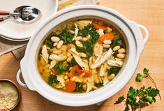 a white bowl filled with pasta and vegetables