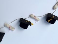 graduation cap and tassels hanging from string