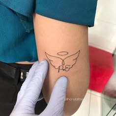 a person getting a tattoo on their arm