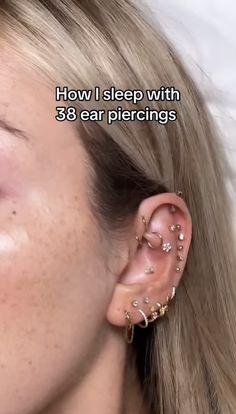 a woman with ear piercings on her right side and the words how i sleep with 38 ear piercings