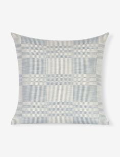 a blue and white checkered pillow on a white background