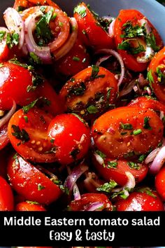 a blue bowl filled with tomatoes and onions