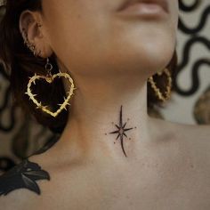 a woman with a tattoo on her neck is looking up at the sky and stars