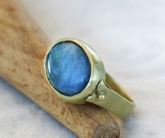 "A unique piece of gemstone ring made elegant with a natural Aquamarine stone, set in bezel of 14k yellow gold fill. A gold ring that has a touch of both classic and modern style. A 14k ring that will suit for everyday use and easy to incorporate into your casual, formal and boho looks. Wear and style with other stackable rings for women and create your own jewelry combinations. Product Details: --------------------- Ring Size: Please select from the drop-down menu. Ring width: 0.19\"/ 4.7mm Sto Unique Oval Moonstone Ring With Bezel Setting, Unique Oval Opal Birthstone Ring, Unique Oval Birthstone Ring, Unique Oval Moonstone Birthstone Ring, Unique Oval Emerald Promise Ring, Oval Cabochon Sapphire Promise Ring, Handmade Heirloom Oval Sapphire Ring, Oval Large Stone Sapphire Ring Gift, Unique Oval Sapphire Birthstone Ring