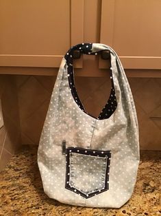 a white purse sitting on top of a counter