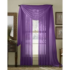 purple sheer curtains hanging in front of a window