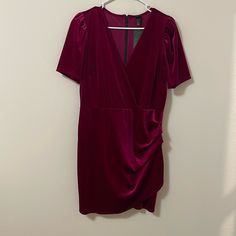 Gorgeous, Sexy Velvet Dress In A Lovely Magenta Color With Short Puffed Sleeves That Give A Sort Of 80s Vibe, A Ruffled Faux-Wrap Skirt, Back Zipper, And Plunging V Neck! 93% Polyester, 7% Spandex 20in/51cm Pit-To-Pit, 16in/41cm At Waist When Flat, 19.25in/49cm Waist To Hem, 35in/89cm Shoulder To Hem Fitted Mini Dress With Surplice Neckline For Brunch, Short Sleeve Lined Midi Dress For Party, Stretch Mini Dress With Surplice Neckline For Date Night, Lined V-neck Bodycon Dress For Night Out, Ruched Short Sleeve Mini Dress For Date Night, Date Night Stretch Mini Dress With Surplice Neckline, Flirty Short Sleeve Bodycon Dress For Date Night, Fitted Mini Dress With Surplice Neckline And Dressy Style, Fitted Dressy Mini Dress With Surplice Neckline