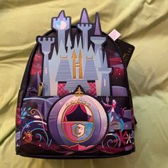 This Is A Beautiful Loungefly Cinderella’s Castle Mini Backpack. It Has Eve On It From The Chariot To The Mice. On The Back It Says A Dream Is A Wish Your Heart Makes. Just Beautiful. Minion Halloween, Loungefly Mini Backpack, Disney 50th Anniversary, Disney Treats, Mini Backpack Purse, Mickey Halloween, Purple Backpack, Loungefly Bag, Women Crossbody Bag