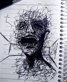 a drawing of a man's face is shown in black ink on lined paper