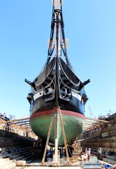 a large boat sitting on top of a dry dock