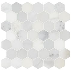 white and grey hexagonal marble tile with gray dots on the bottom, in an angled pattern