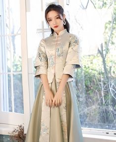 Elevate your Chinese culture with this stunning 2 pieces bridesmaid qipao/cheongsam dress. Crafted from beautiful floral brocade fabric for the bodice and soft tulle for the A-line skirt, this traditional Chinese dress showcases a mandarin collar and elegant frog buttons. It’s the perfect choice for your non-traditional traditional wedding and a standout piece for any bridesmaid attire. Please note Asian size run small refer to the size chart in the picture Please leave the Height, Weight and Bu Brocade Banquet Dress, Fitted Ao Dai With Stand Collar For Ceremony, Spring Wedding Cheongsam With Stand Collar, Wedding Cheongsam With Stand Collar, Fitted Hanbok For Spring Wedding, Spring Ceremony Fitted Cheongsam, Spring Wedding Hanbok, Banquet Ao Dai With Stand Collar, Frog Buttons