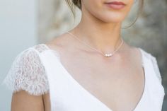 This pretty necklace with back jewel will be perfect to enhance the backless neckline of your wedding dress. The delicacy of its pearls will charm you and bring a very elegant touch to your outfit.It consists of a silver chain, three pearl beads on the front and three dinging on the back.This necklace has no clasp, it simply slips by the head, so you will have to pay attention to the larger hairstyles.Available in silver, gold filled (high quality gold plated) and gold filled rose (high quality Elegant Rose Gold Necklace For Mother Of The Bride, Elegant Pearl White Backdrop Necklace, Elegant Pearl Chain Bridal Necklace, Dainty Pearl Chain Backdrop Necklace For Party, Elegant Pearl Pendant Backdrop Necklace For Party, Feminine Pearl Embellished Necklaces For Wedding, Elegant Pearl White Necklaces For Weddings, Elegant Pearl Charm Bridal Necklace For Wedding, Feminine Silver Pearl Necklace For Wedding