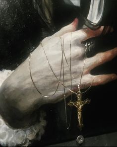 a painting of a hand holding a wine glass with a chain attached to the wrist