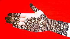 a woman's hand with henna on it