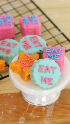 some cookies that are sitting on a plate with words written on them and stars in the middle